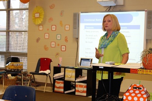 Elsanor School guidance counselor Patty Mulkey teaches the “Happy Families” program to a group of parents at the school.