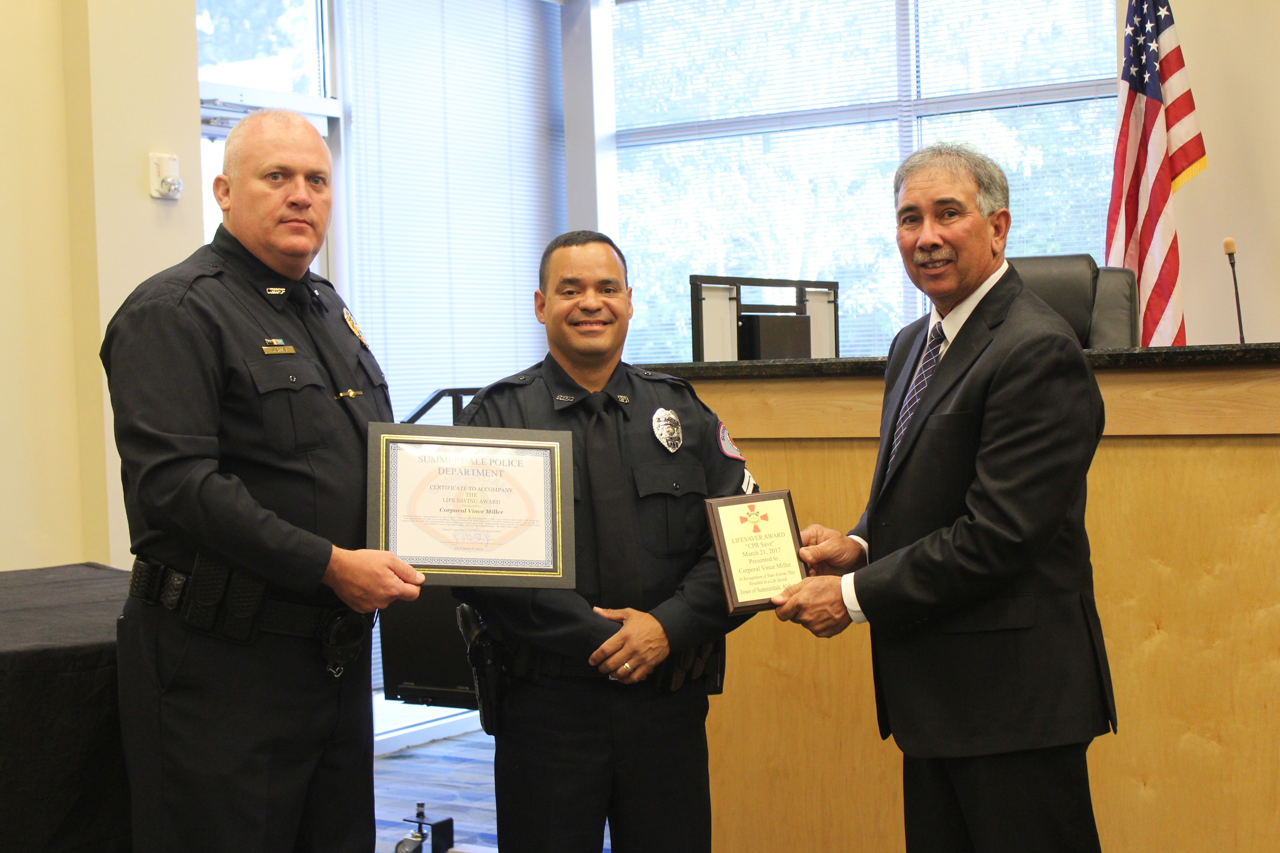 Cpl. Vince Miller with the Summerdale Police Department received one of three lifesaving awards at the Summerdale Town Council meeting on April 10.
