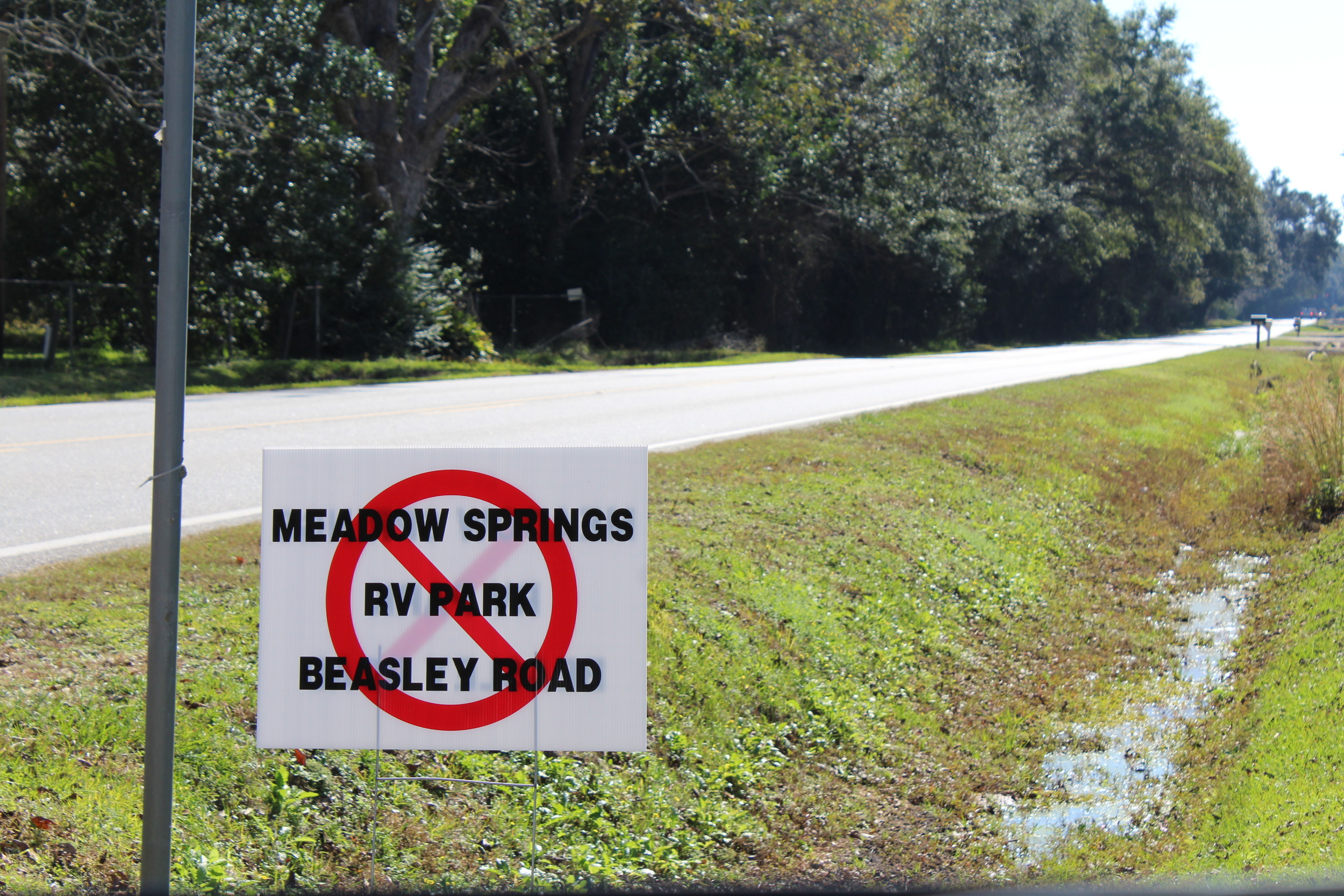 Signs protesting the proposed Meadow Springs RV Park have been placed along Beasley Road.