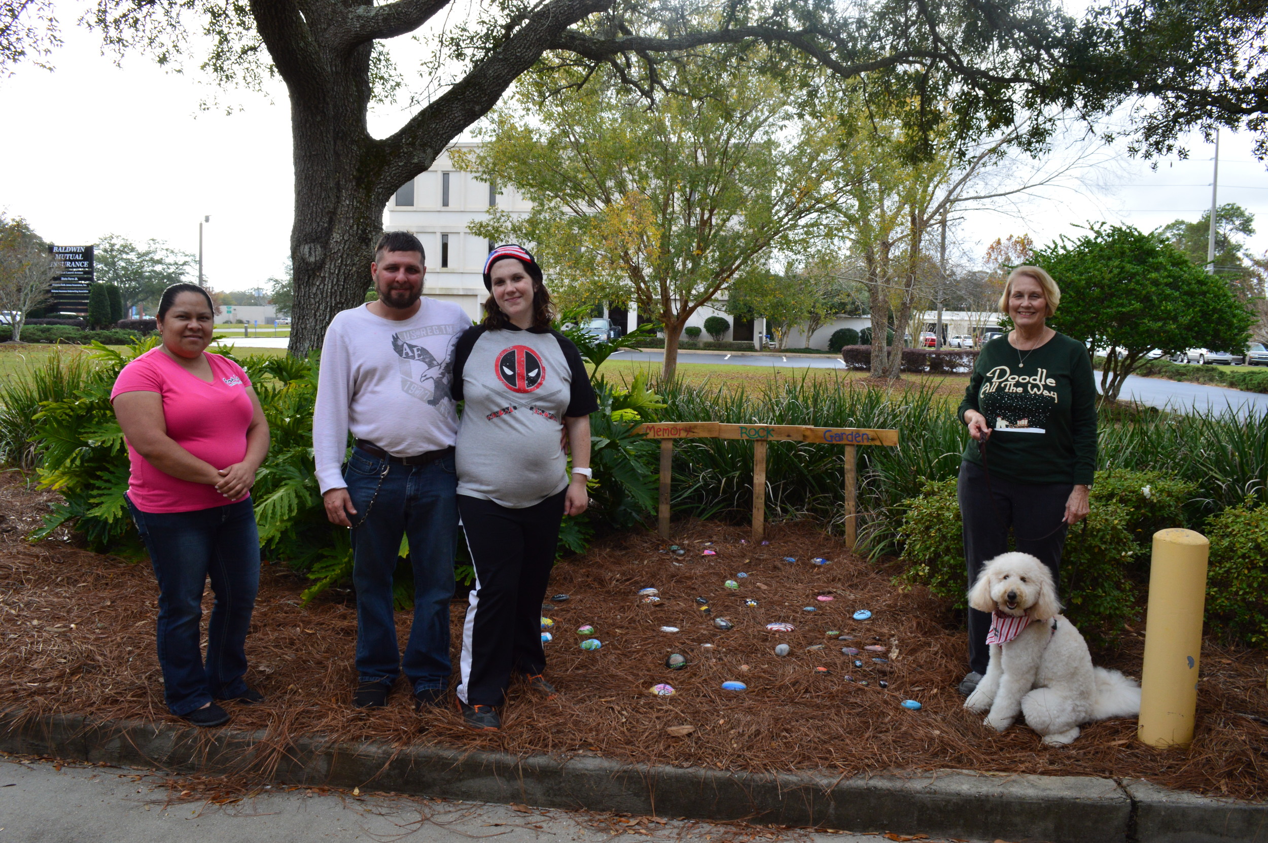 Pictured left to right: Sonia Cruz, Daniel Englert, Rachel Marotte, Lynda Folks (with her dog, Lottie May), have all contributed rocks to the Memory Rock Garden to honor special people and moments in their lives.