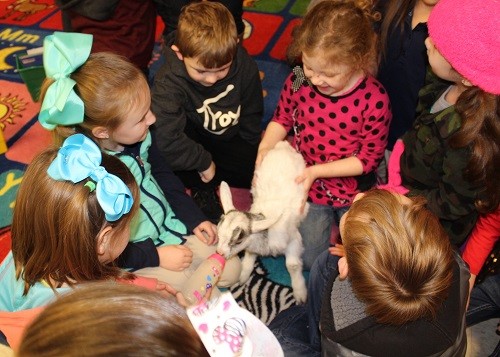 Pictured feeding Cupid and Prancer are kindergarten students Ana Leah Hayes, Trenton Hadley, Ana Reese Bryant, Jaley Brinkman, Ethan Harville and Vivyenne Duff.