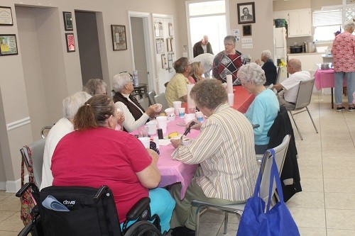 Adult Activity Center Director Sarah Duncan mingles with the crowd at the monthly soup kitchen.