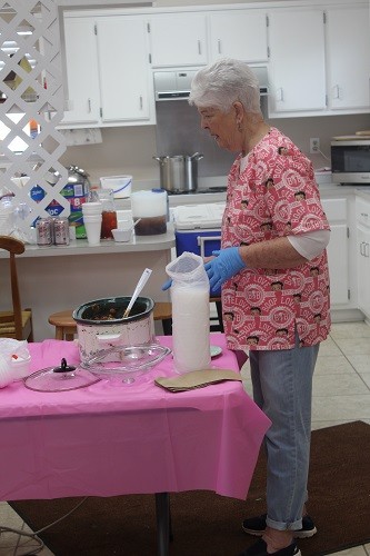Organizer Becky Hayes checks on beef stew served during the January soup kitchen Friday at the George P. Thames Adult Activity Center in Robertsdale.