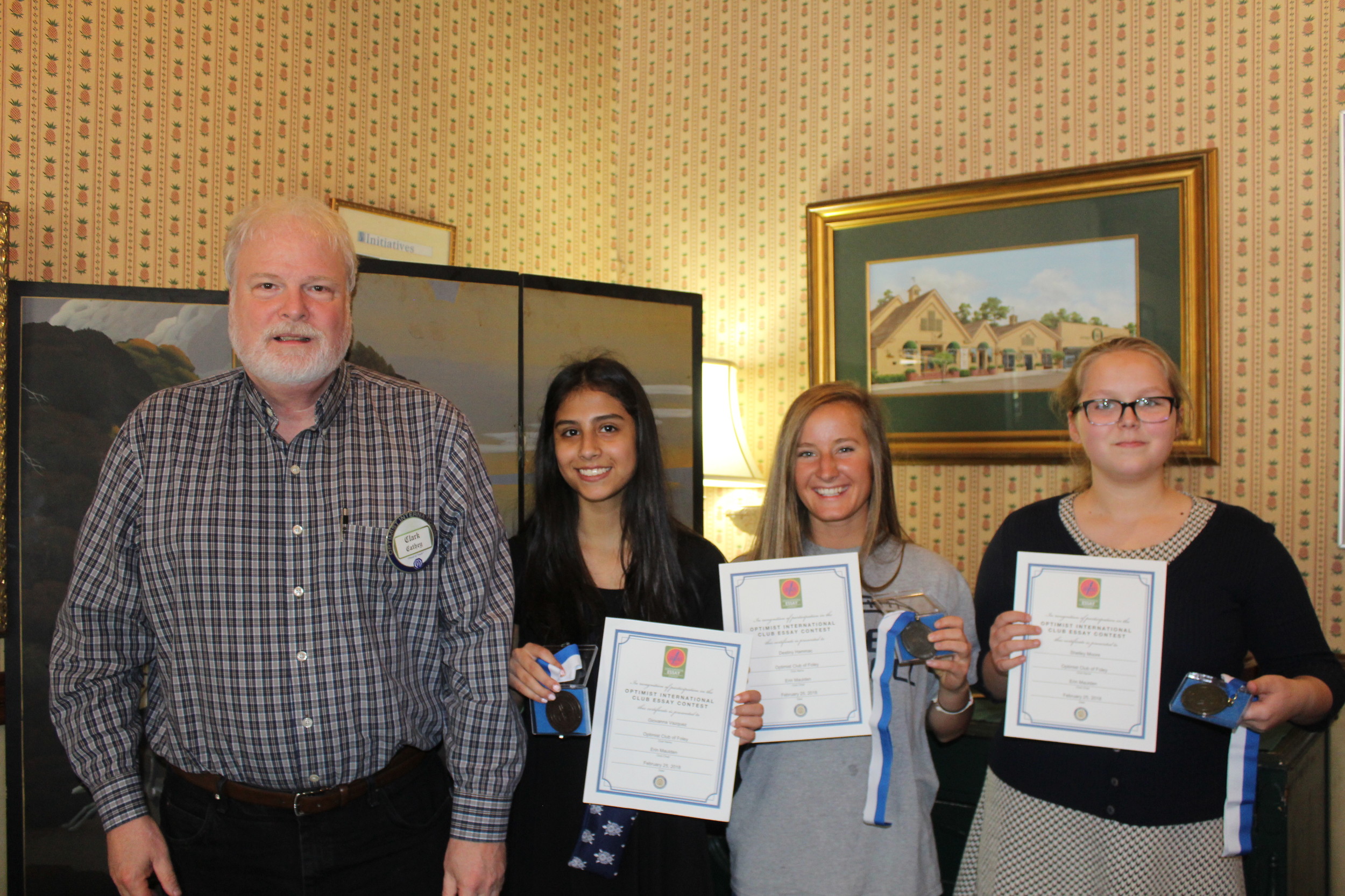 From left to right: Optimist Club President Elect Clark Cathey; 3rd place winner Giovanna Vazquez; 2nd place winner Destiny Hammac; 1st place winner Shelley Moore.