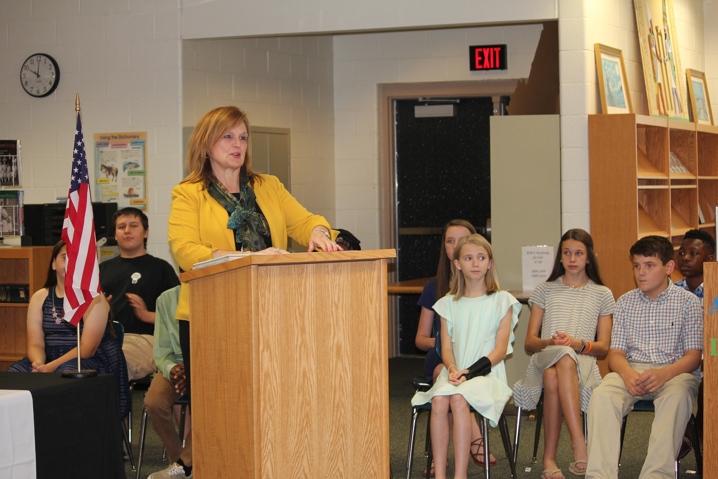 Baldwin County High School National Honor Society sponsor, Judy Bridges, addressing the Bay Minette Elementary Junior National Honor Society.