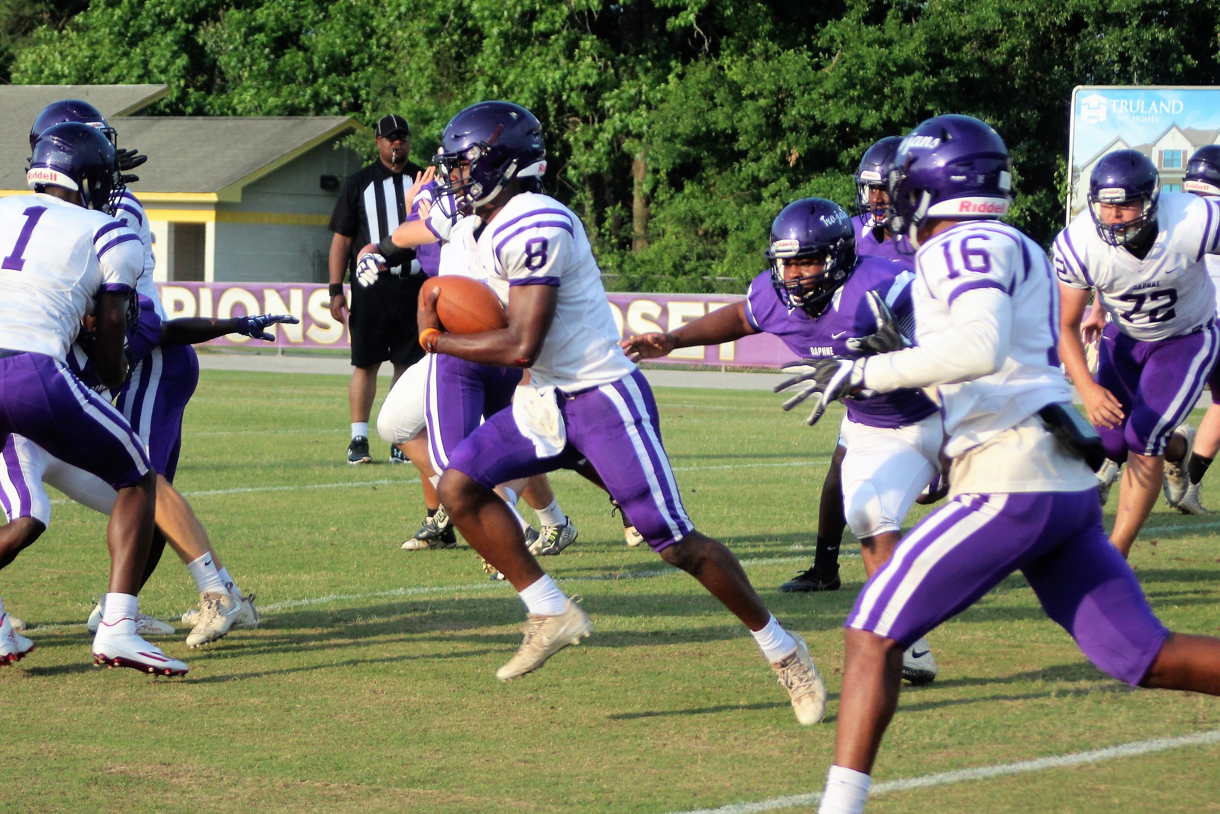 Daphne quarterback Trent Battle picks up yards on the ground during the Purple and Gold Spring Game at Jubilee Stadium May 18, 2018. Battle, now a member of the TCU Horned Frogs, will play for the national championship Monday night at SoFi Stadium.