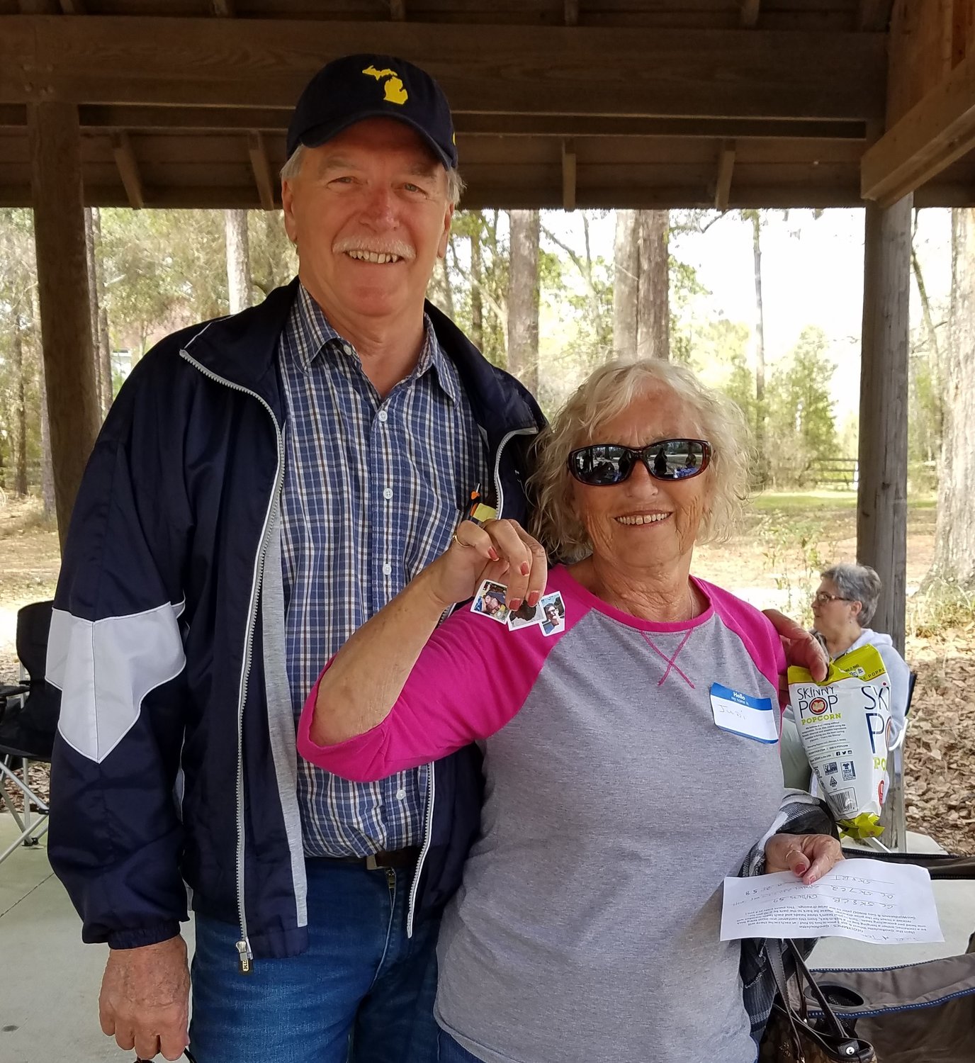 Geocachers Judi and Tom show off their finds in 2018.