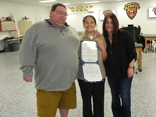 David Seladones (pictured with his wife Elaine and daughter) of Lillian credits his daughter, Sierra, with saving his life during a rafting trip in October. Sierra, a ninth-grade student at Elberta High School and a cadet seaman apprentice with the Robertsdale High School Naval Junior ROTC, was awarded the Meritorious Achievement Ribbon, the highest honor a cadet seaman apprentice can receive, during a ceremony held Wednesday, Jan. 30 at RHS.