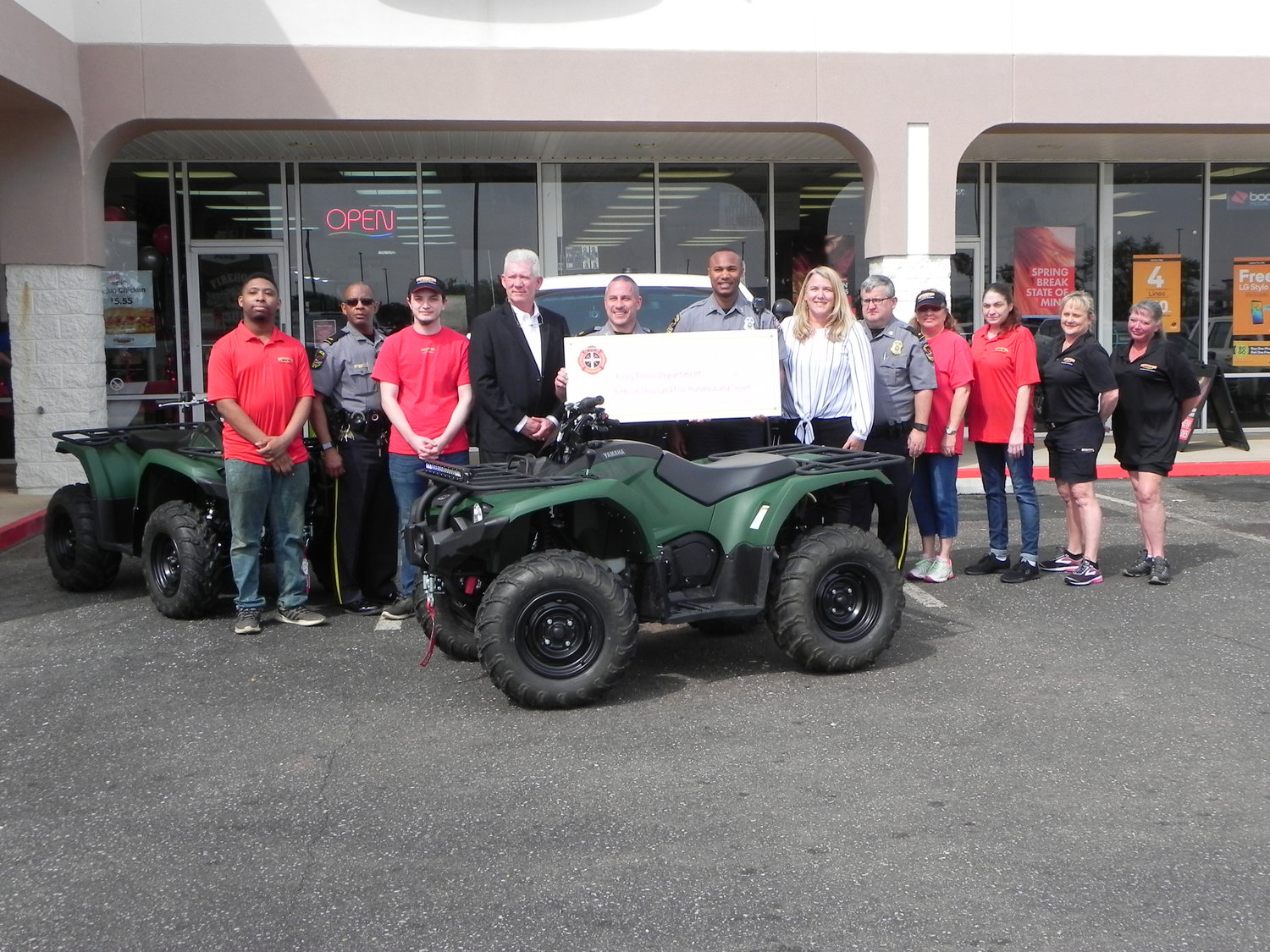 Foley PD officers, representatives from Firehouse Subs Public Safety Foundation, and Foley Firehouse Subs employees with the new ATVs donated to the Foley PD through a grant awarded by the foundation during a presentation at the Foley Firehouse Subs.