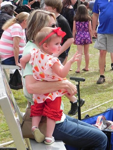 A young festival goer enjoys the festivities at the 2018 Baldwin County Strawberry Festival in Loxley.