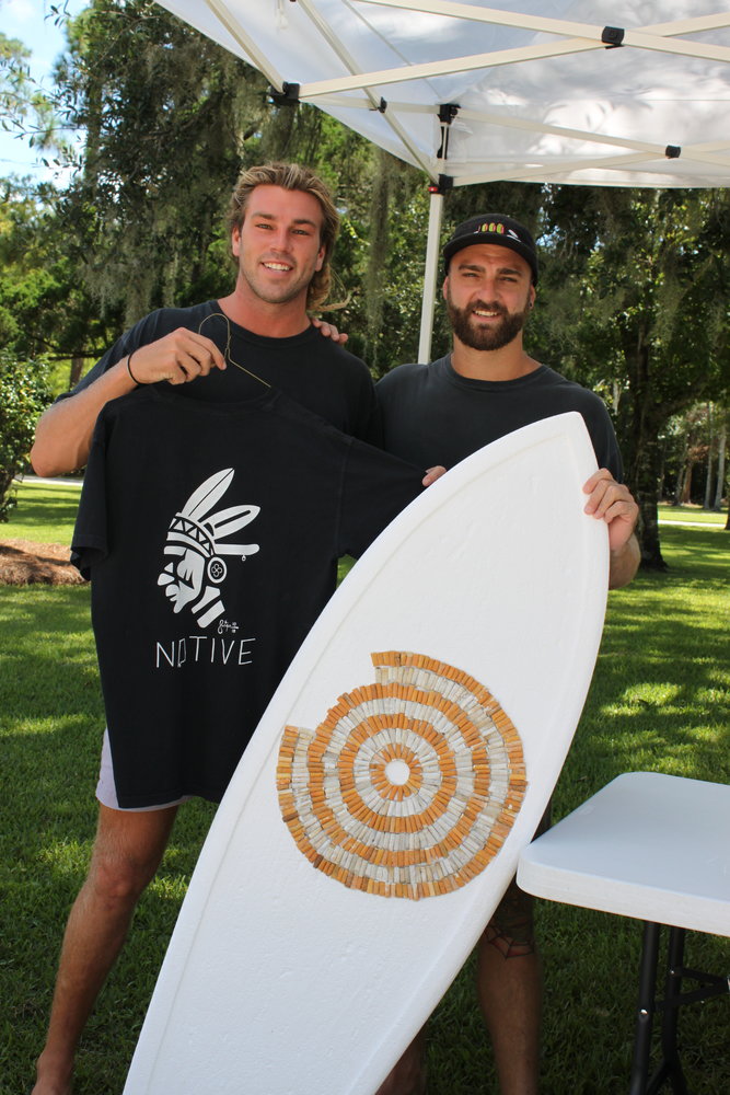 JD and Michael Swiger of Swiger Studio are turning trash into art using cigarette butts to create a pattern on this surfboard. They plan to use over 3,000 butts collected from our beaches.