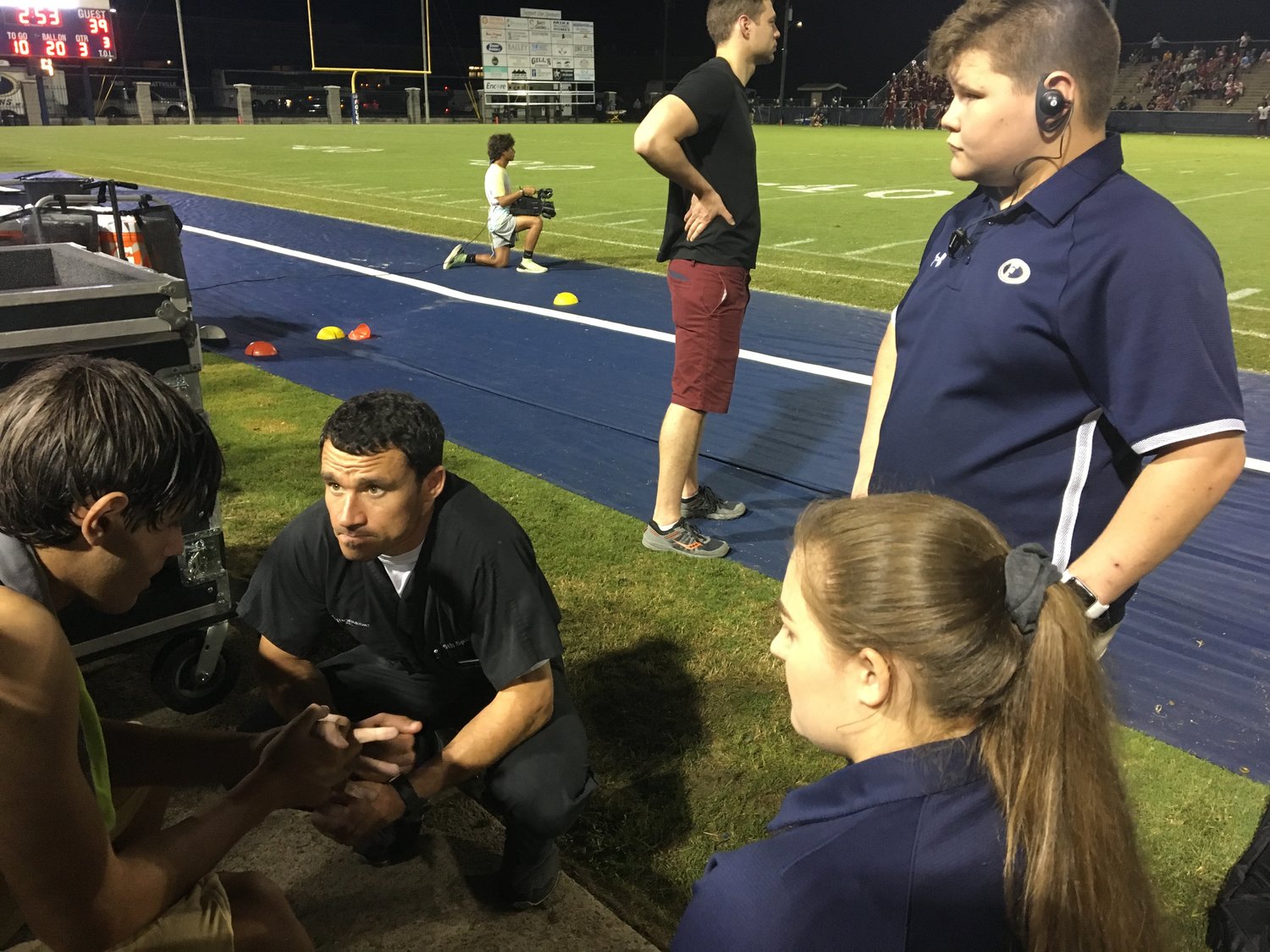 Students participating in the field experience portion of the program are able to attend sporting events and watch as Dr. Keith Spain evaluates injuries on the sidelines.