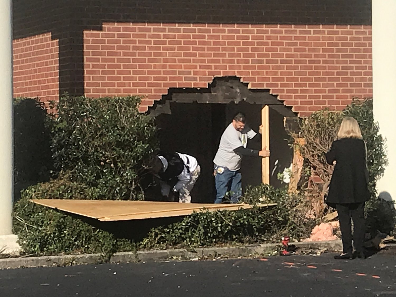 Crews begin work on Wednesday, Nov. 13 to repair damages to the Peachtree Professional Center.