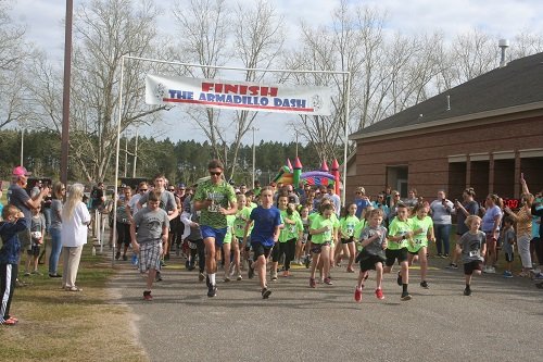 On your mark, get set, race! Runners take off at the start of last year's Armadillo Dash at Rosinton School. This year's race will be held March 7.