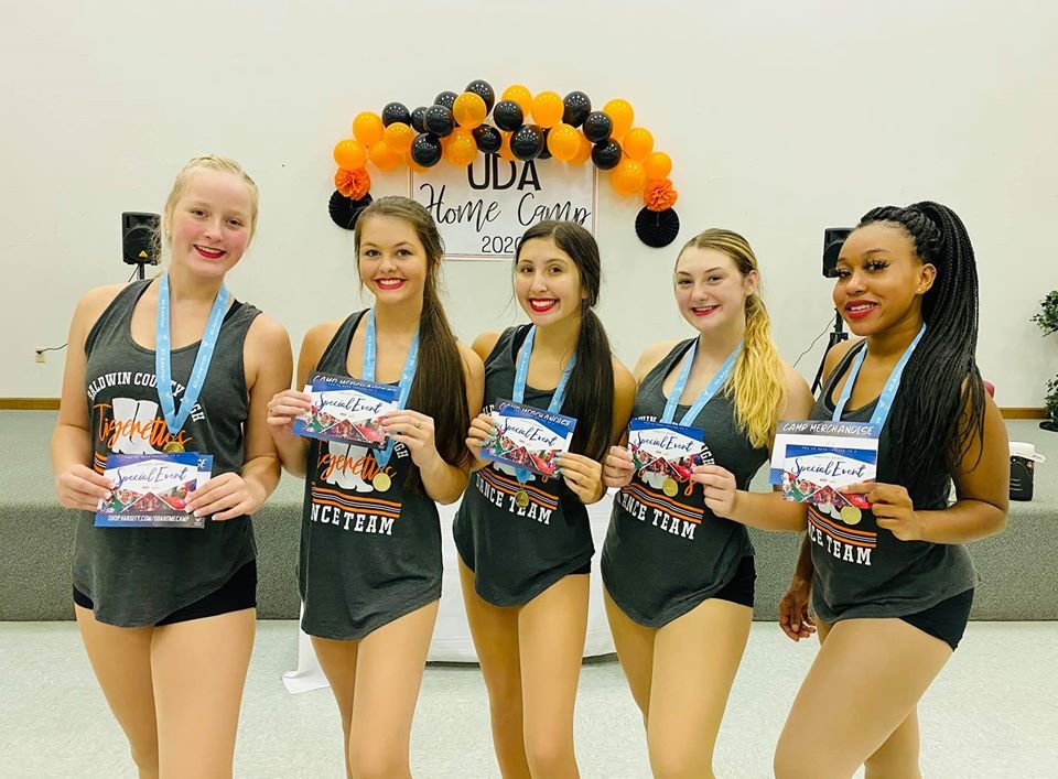 Sara Munson (Freshman), Allison Smith (Sophomore), Emma Quezada (Senior), Morgan Bright (Senior), and Brasia Banks (Senior) earned the distinguished title of UDA All-American and will get the opportunity to travel to London for their New Year’s Day Parade.