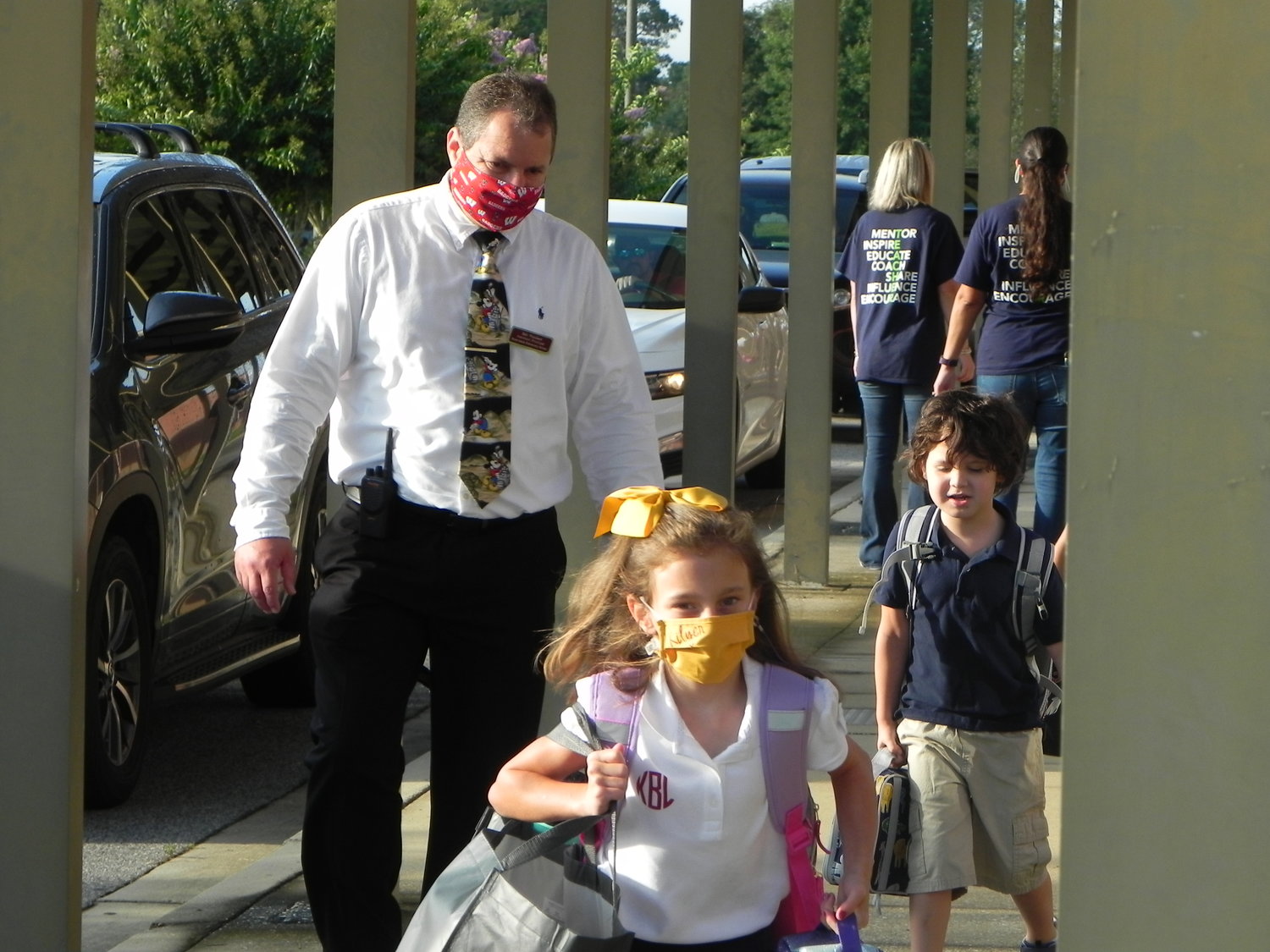Robertsdale Elementary School Assistant Principal Robert Weichert greets students on the first day of school Wednesday.