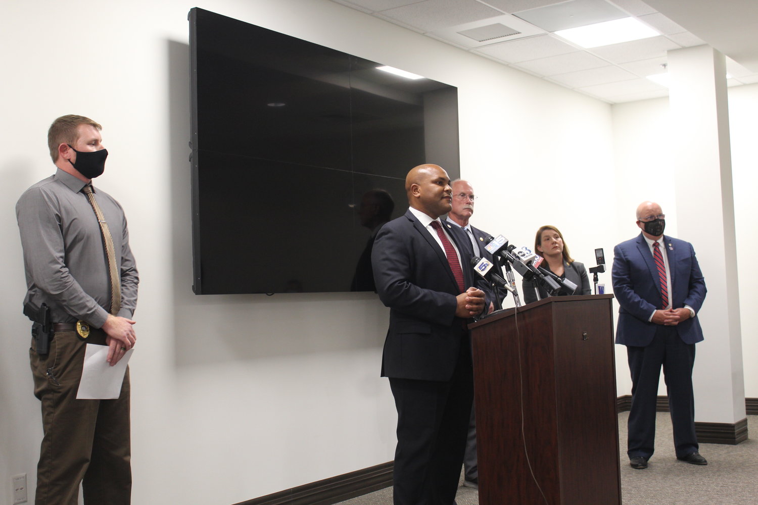 Pictured with Baldwin County officials, from left, Lt. Andre Reid, commander of the Baldwin County Major Crimes Unit, District Attorney Bob Wilters, lead prosecutor Teresa Heinz and Baldwin County Sheriff Hoss Mack, is Sgt. Joshua Grace (far left) with the Crestview (Florida) Police Department. Antwon Smith, charged with capital murder in the deaths of Ryan Fraizer and Joshua Carroll near Elberta, is also a person of interest in a missing persons case in Florida.