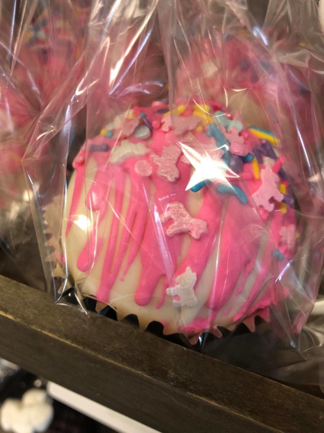 Sugar House Custom Cakes in Fairhope has hot chocolate bombs in store every day, but they go quick so get there early. They make a variety of flavors too like this strawberry unicorn.