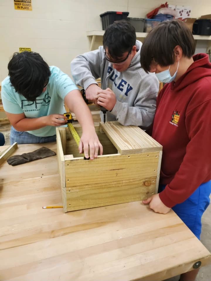Foley High School students design the Stick Library.