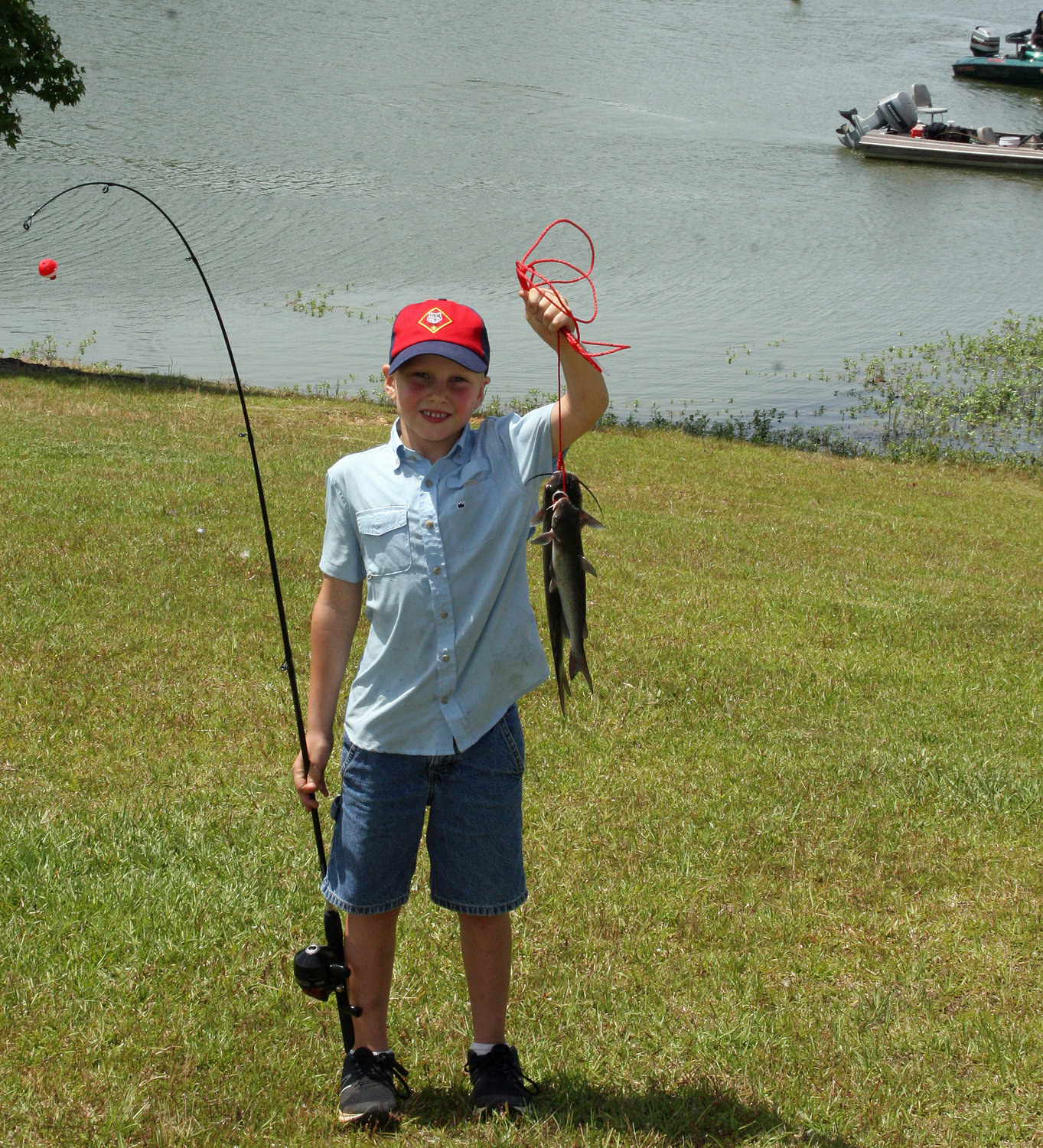 Harland Atkins, who attended the Go Fish, Alabama! event with his dad Brad, shows off his catch from Bibb County Lake.