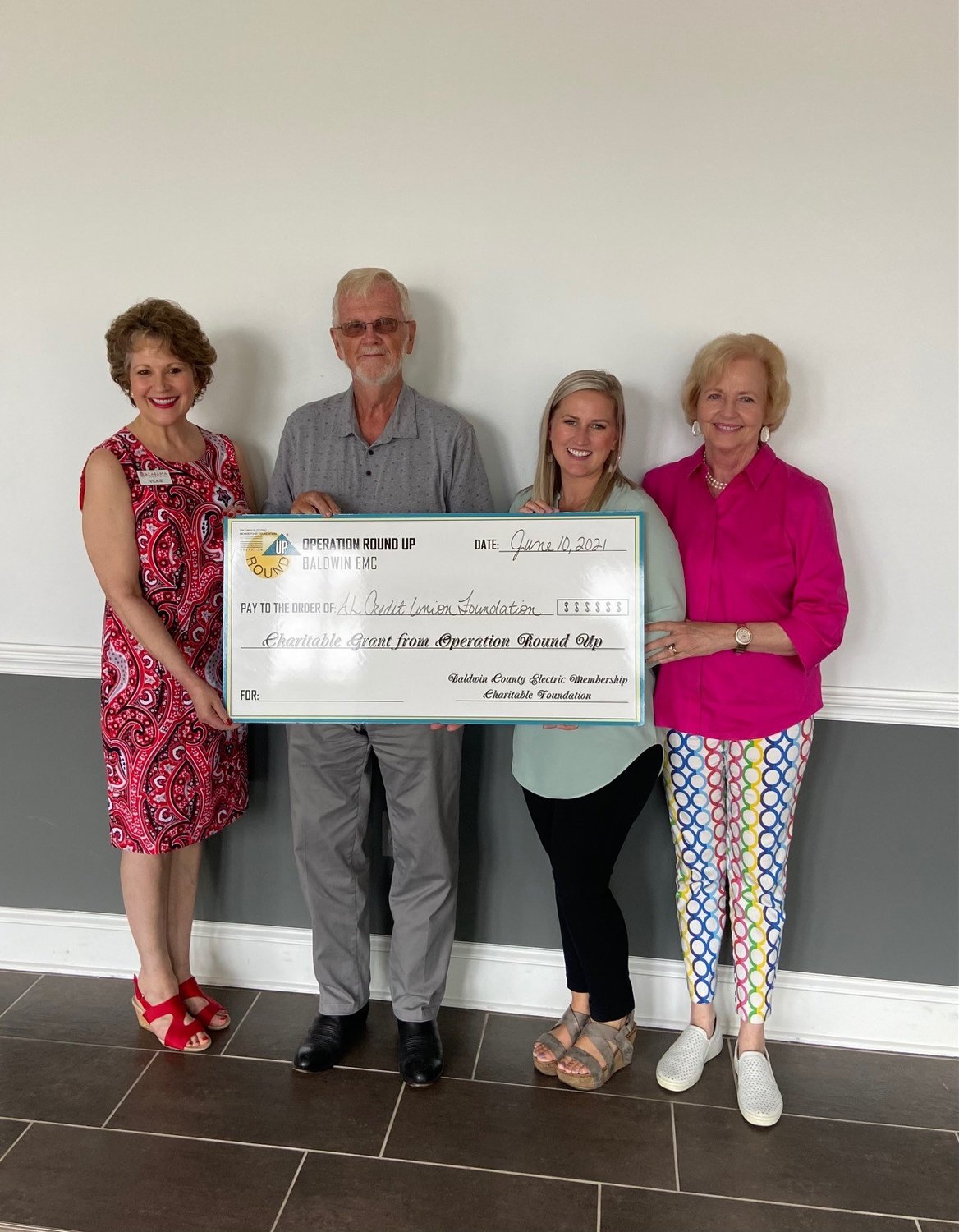 6.ORU Foundation Vice Chairman Oswalt Lipscomb (second from left) and Secretary Mary Lou McMillan (far right) make a grant presentation to Alabama Credit Union Foundation representatives Vickie Loper and Bonnie Bell.