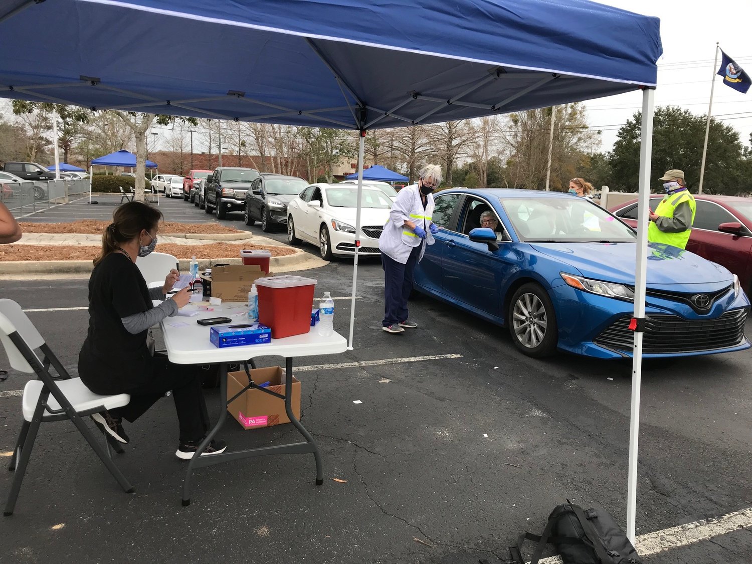 Baldwin County Department of Public Health and Emergency Management Agency officials conduct a vaccine clinic in Daphne in January 2021. The Baldwin County Commission voted in July to lift the COVID-19 state of emergency in place since March 2020.