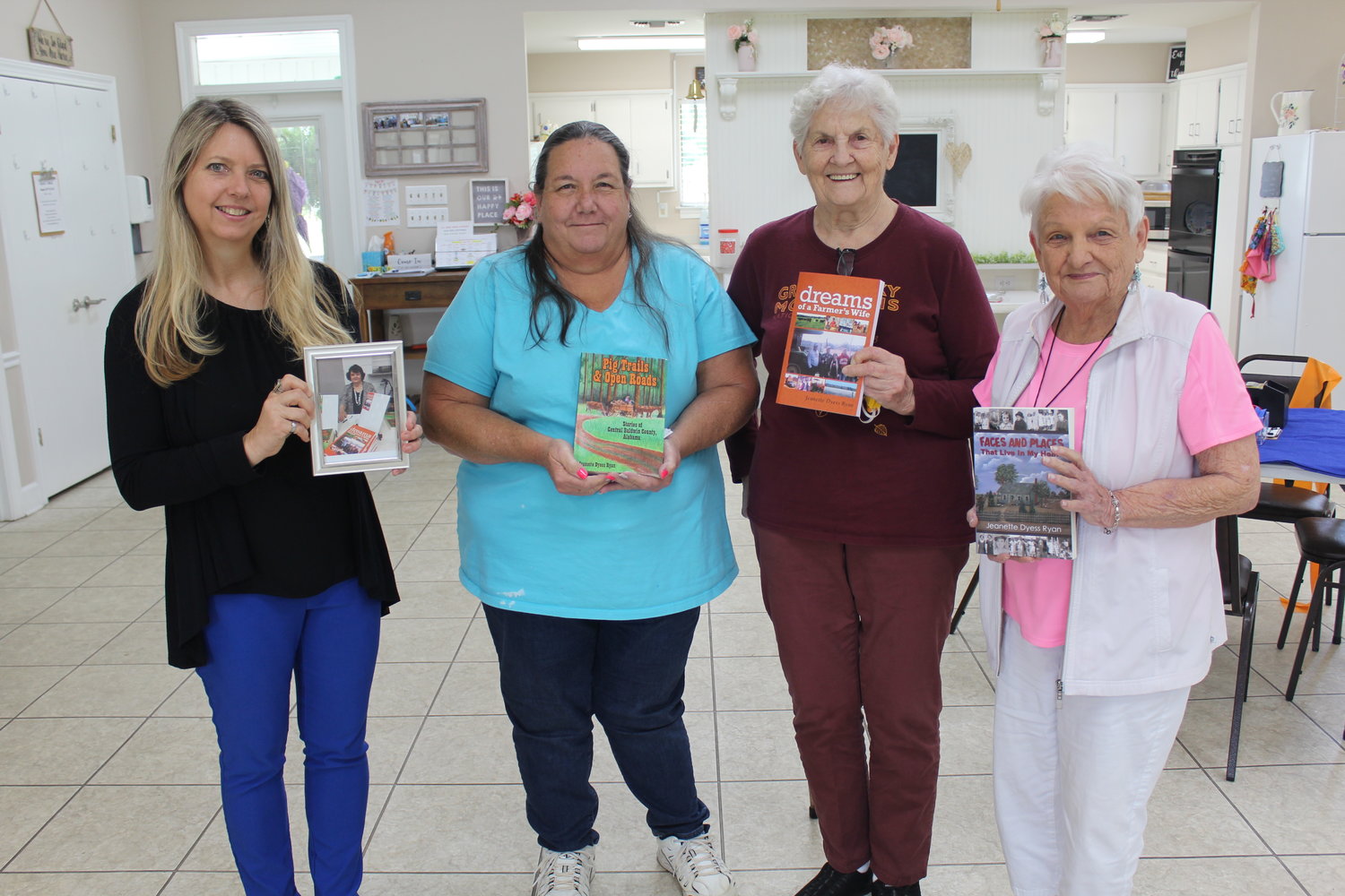 Twila Unsderfer, daughter of author Jeanette Ryan, brings signed copies of Ryan’s books to the George P. Thames Adult Activity Center in Robertsdale. Pictured with, from left, Mary Williams, Eddie Joan Bedwell and Dot Thorne.