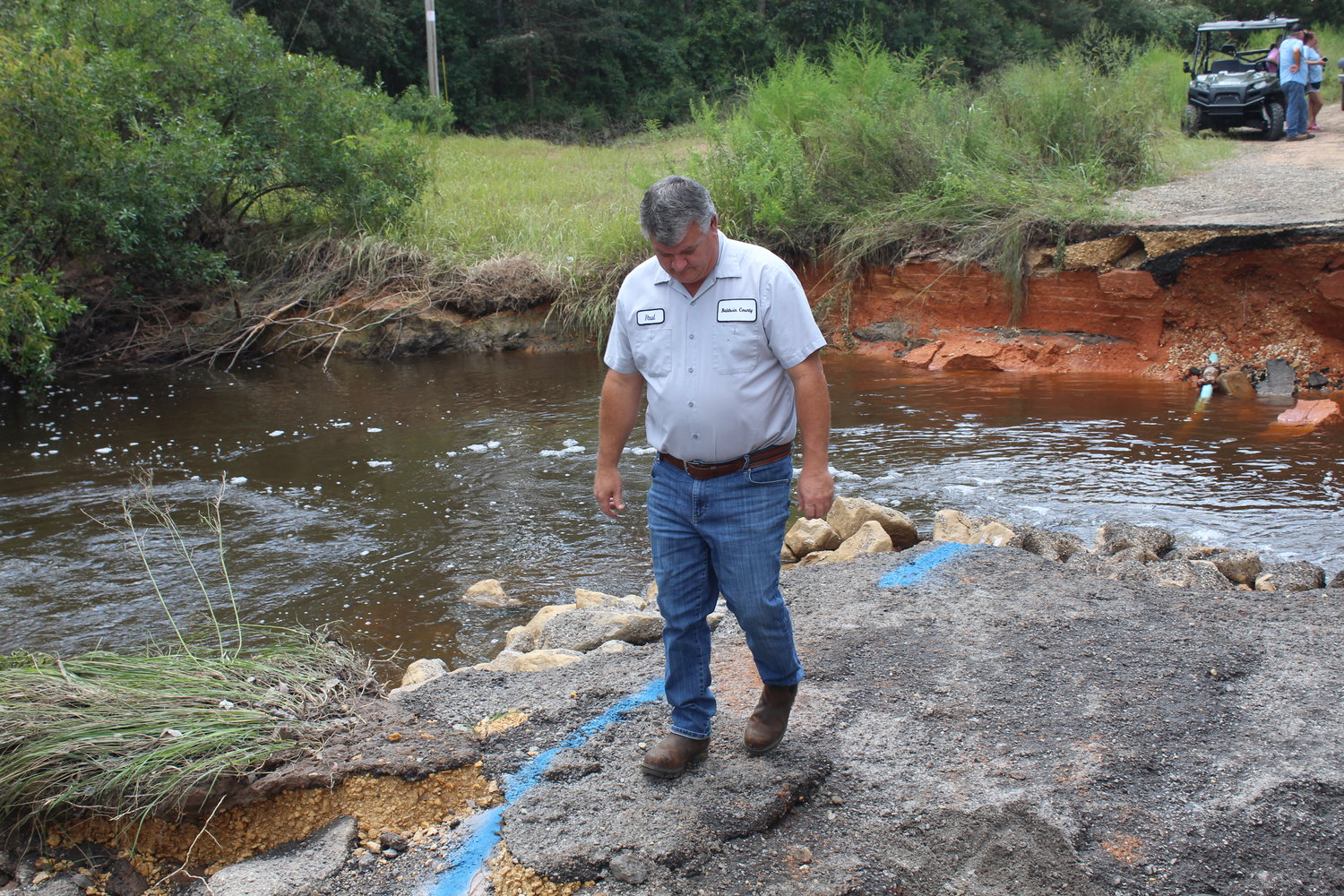 Paul Penry, maintenance supervisor with the Baldwin County Highway Department, inspects River Road on Wednesday, Sept. 1.