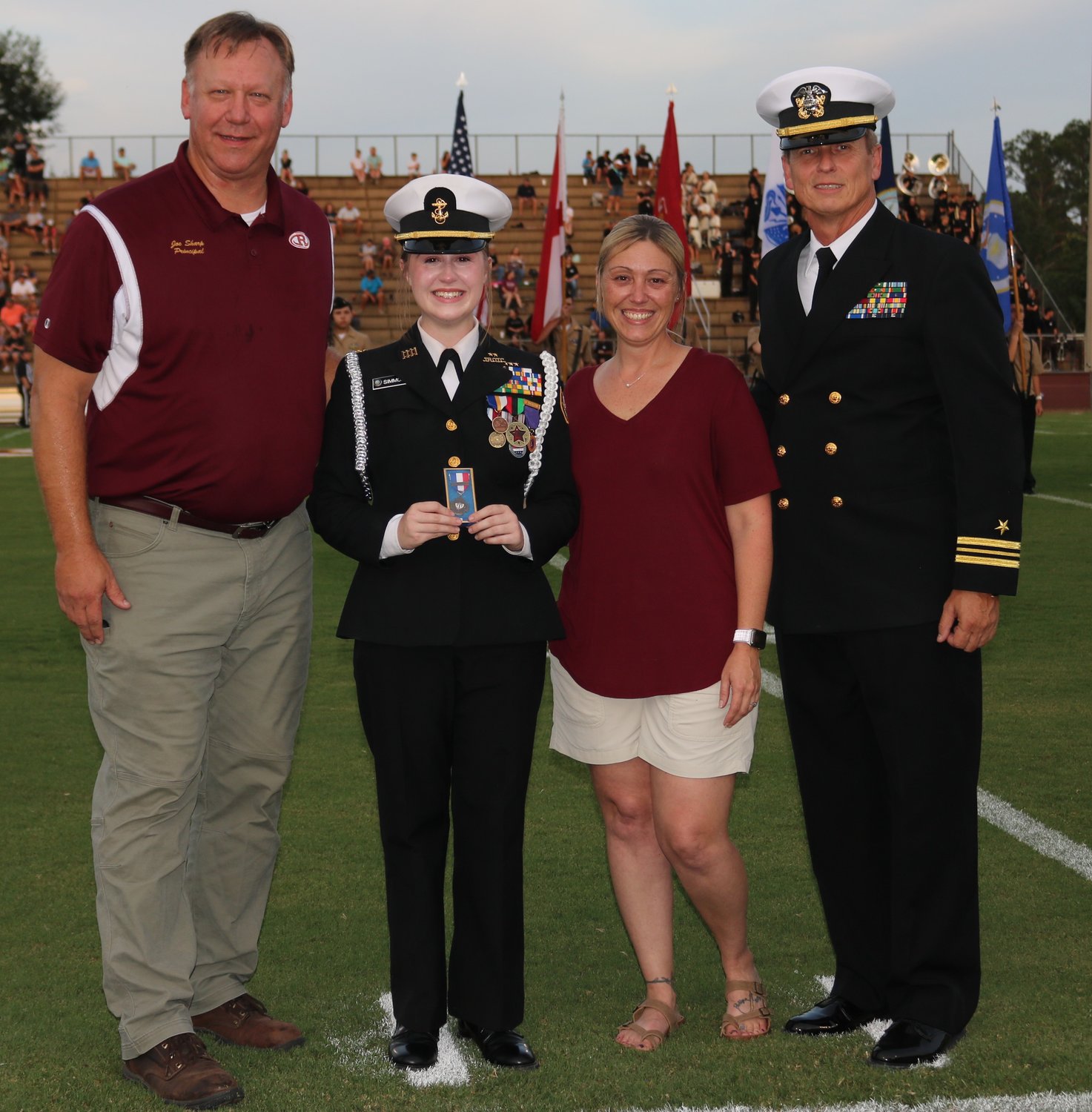 Cadet Ashlynn Simmons is the fourth member of the Robertsdale High School Naval ROTC in a row to receive the Legion of Valor Bronze Cross for Achievement, the highest honor a Navy Junior ROTC cadet can earn. He is pictured with her mother, RHS Principal Joe Sharp and RHS NJROTC Commander Frank Starr.