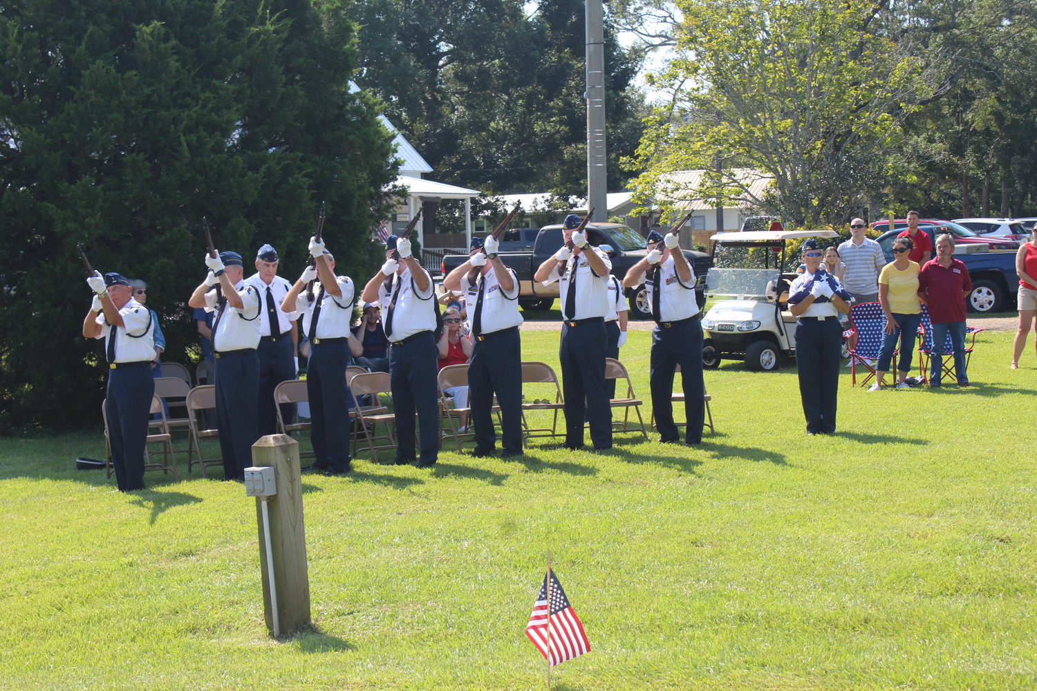 The U.S. Armed Forces Honor Guard of Baldwin County presents a 21-gun salute.