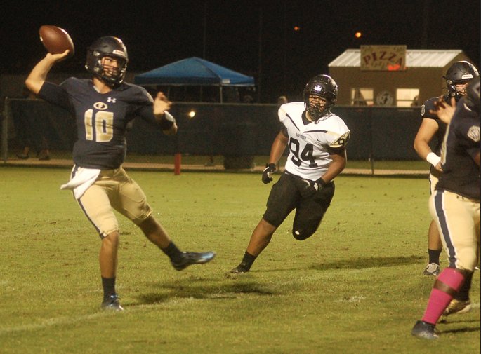 Foley's Reece Tynes spots a receiver downfield. The Lions’ quarterback tossed three touchdown passes and rushed one as Foley defeated Davidson 35-31. Perry Thompson had two touchdown receptions and Harrison Knight had one.