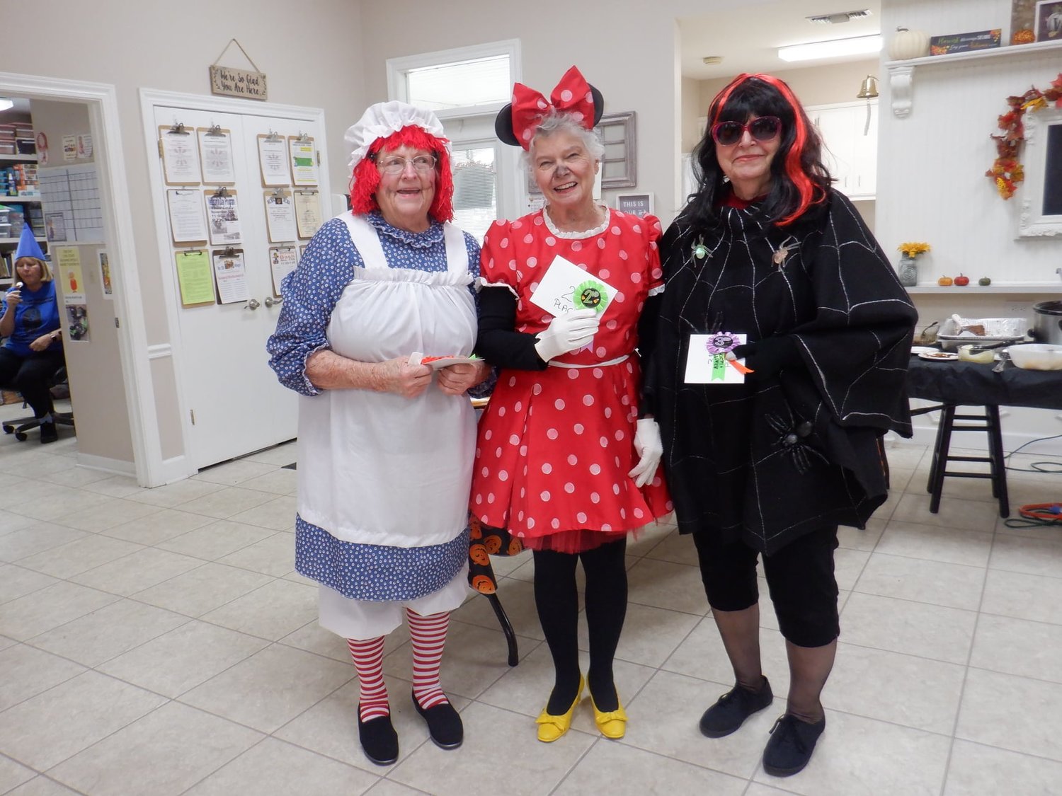 Costume contest winners are, from left, Raggedy Ann, Reta Dressler, first place; Minnie Mouse, Martha Dunn, second; and Spider Lady, Sandy Stillman, third.