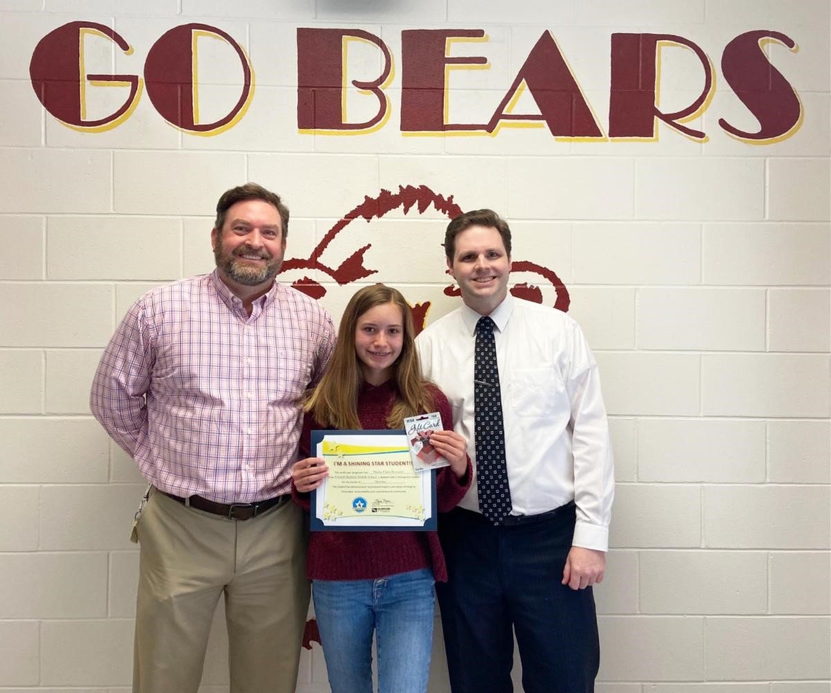 Central Baldwin Middle School student Mattie Claire Burnette (center) is pictured with (l-r) Principal Phillip Fountain and WALA FOX 10 TV’s meteorologist Michael White.