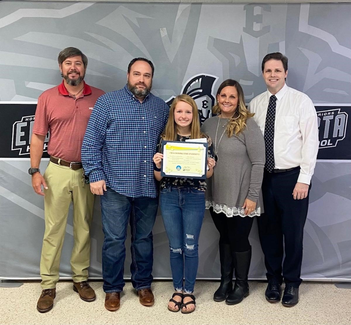 Elberta Middle School student Haley Burnett (holding certificate) is pictured with (l-r) Assistant Principal Thomas Duffy, parents Michael and Ashley Burnett, and WALA FOX 10 TV’s meteorologist Michael White.