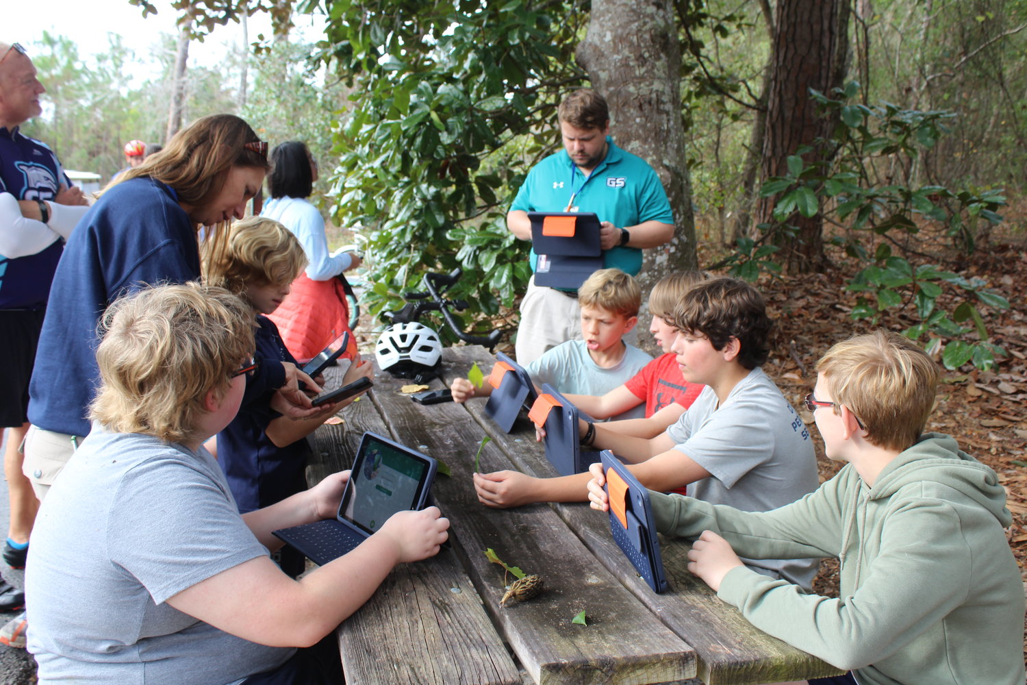 Gulf State Park naturalists  met students on the trail for a STEAM lesson. Dey's students identified leaves using an application on their iPads.