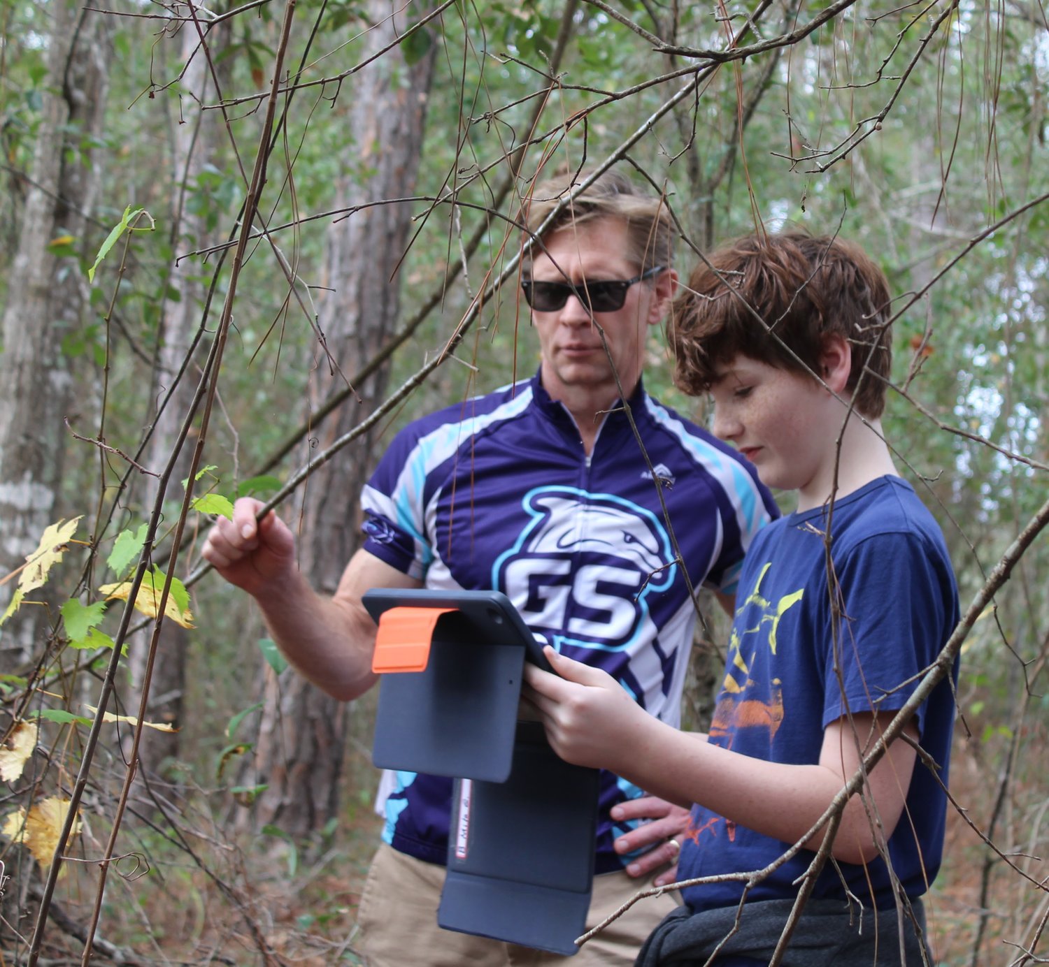 Alabama State Superintendent, Dr. Eric Mackey joined students in the wood to identify leaves.