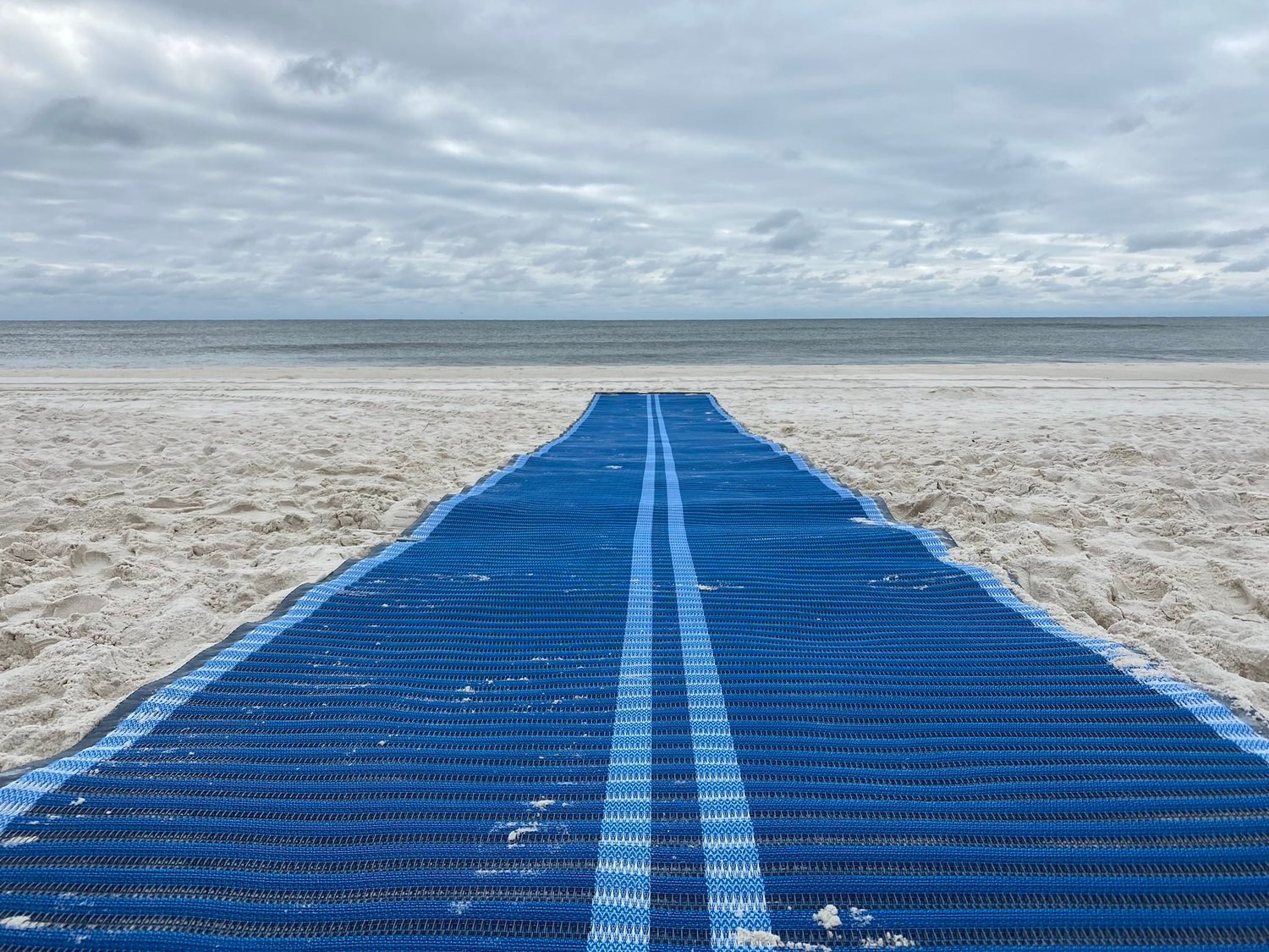 This week, Gulf State Park deployed a Mobi-Mar ADA Beach Access Mat at the west boardwalk. The mat stretches 200 feet from the end of the boardwalk ending just 50 feet from the Gulf of Mexico.