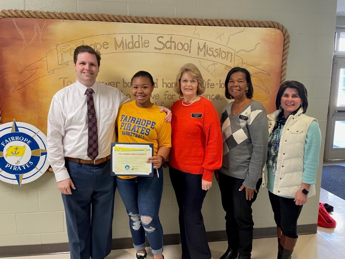 Fairhope Middle School student Zaylee Nanette Bradley (second from left) is pictured with (l-r) WALA FOX 10 TV’s meteorologist Michael White, Registrar Alice Korhonen, Principal Angie Hall and Assistant Principal Tonya Harrelson.