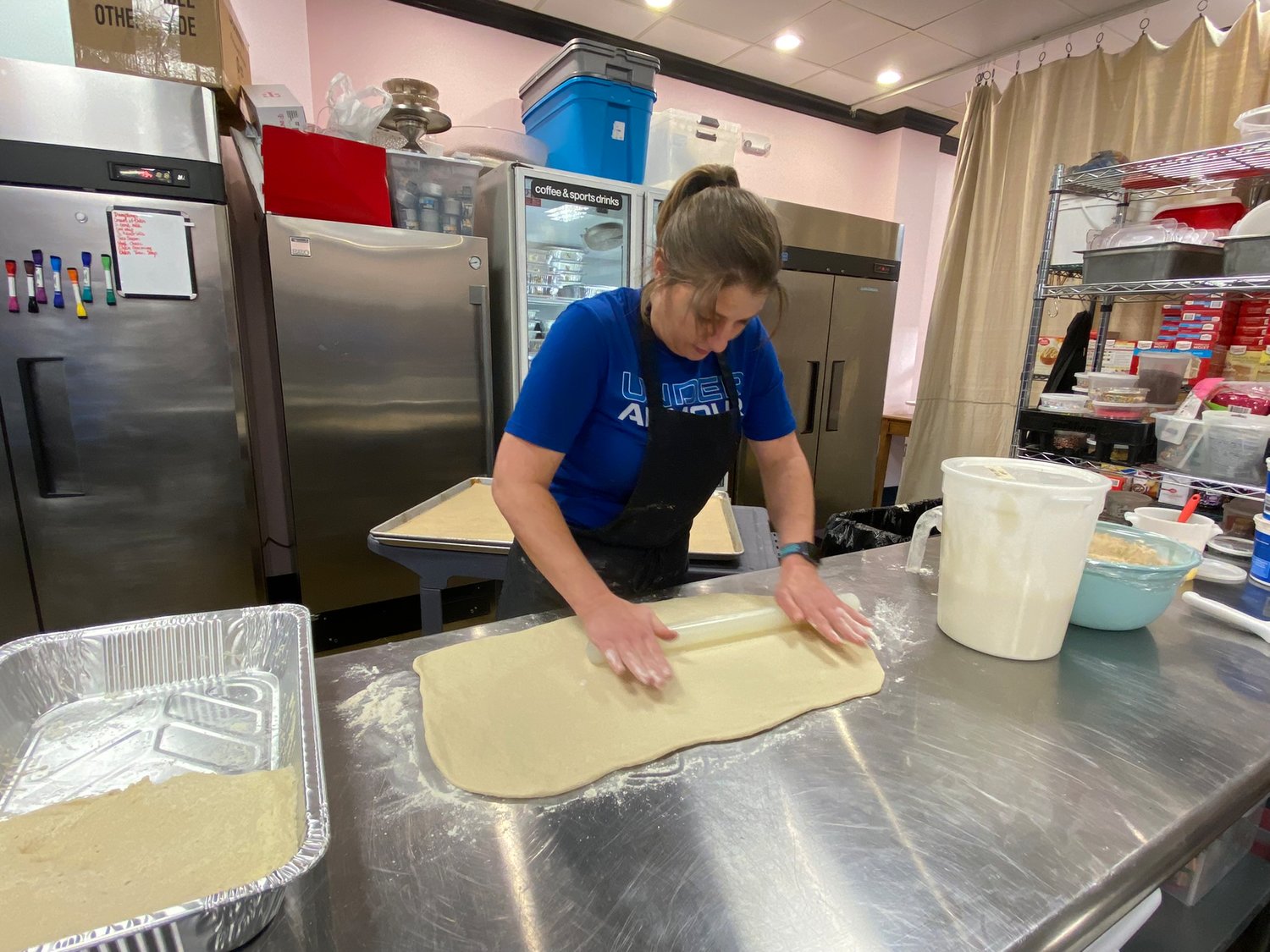Sylkatis rolls out the dough for the King Cake. The dough is used for the savory King Cake is the same dough used for the sweet King Cake, cinnamon rolls, dinner rolls, and bread loaves.