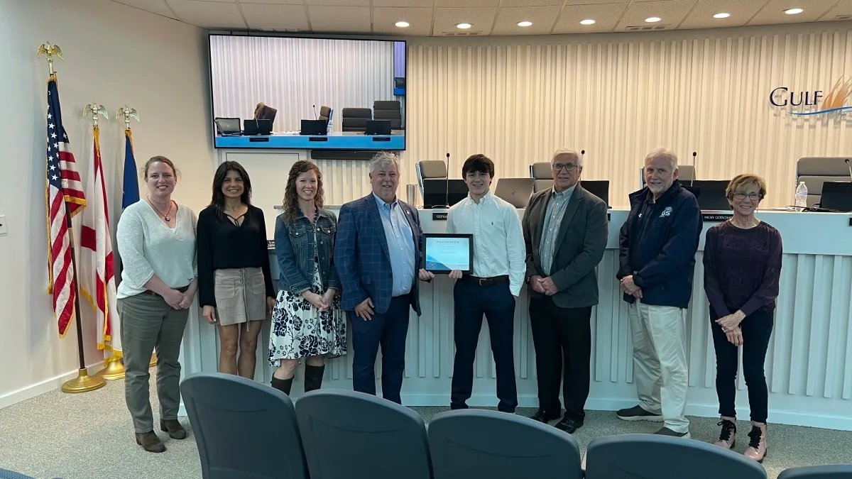 Pictured here, from left: Board Vice President Nicky Gotschall, Assistant Superintendent Dr. Stephanie Harrison, Board Member Kelly Walker, Superintendent Dr. Matt Akin, WaveMaker recipient Rosser “Price” Stephens, Board President Kevin Corcoran, Board Member Frank Malone and Board Member Dale Jernigan.