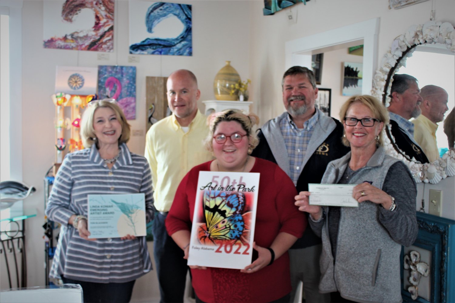 From left: Kelly Crosby, Art in the Park committee member; Tracy Wilhelm, FHS Art Teacher; Tori Blackmon, artist; Russ Moore, FHS Principal; and Vickie Moore, Foley Art Center Board of Directors.