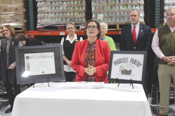Deann Servos speaks at Prodisee Pantry on Tuesday during a press conference to announce its Seal of Excellence from the Standards for Excellence Institute.