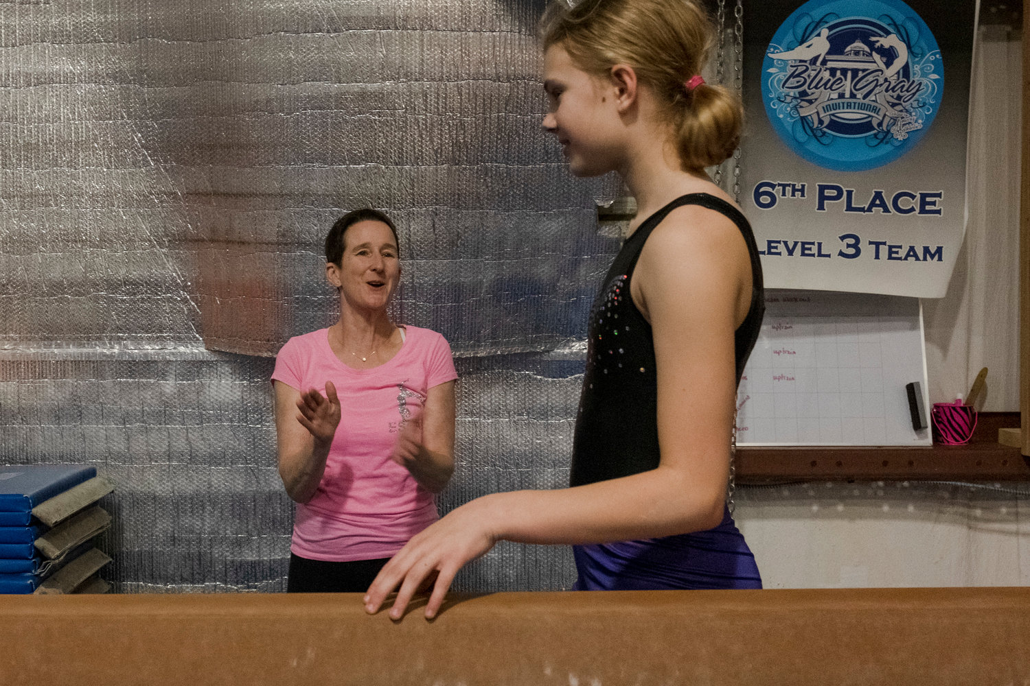 Suzanne Hinkley uses her 30 years of coaching and 14 years of competition judging experience to help her gymnasts refine their skills before the State Championship this weekend in Foley.