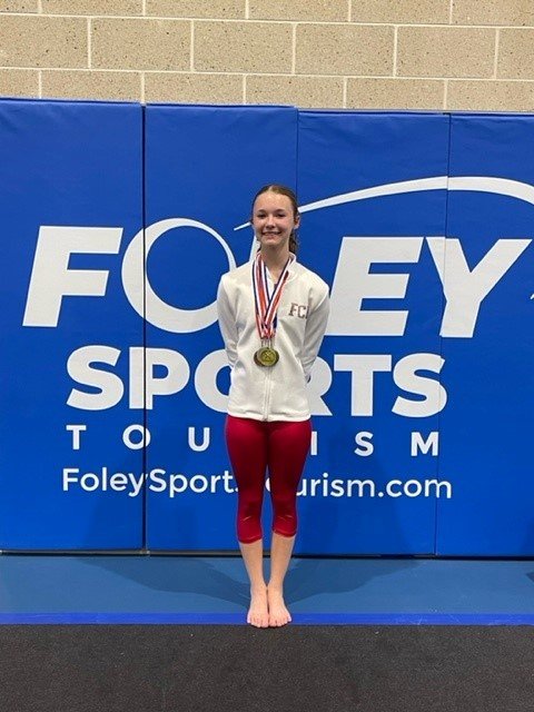 Flip City Academy gymnast Saoirse McDaniel, age 14 of Daphne, qualified for Xcel Gold regionals.
