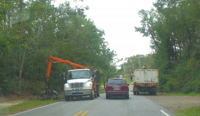 Crews clean debris on Fairhope streets after Hurricane Sally struck the area in September 2020.