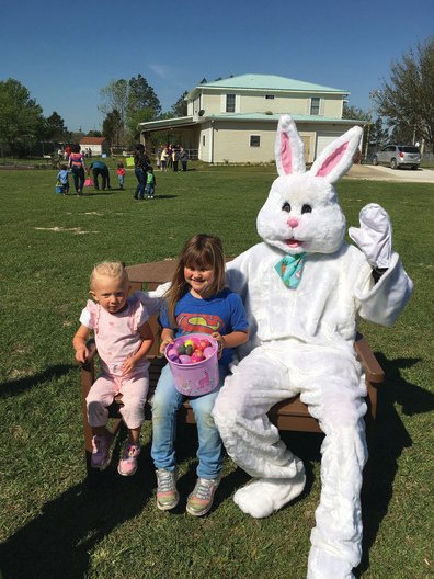Alaya Fierce and Serenity Blocker visit with the Easter Bunny during the 2021 Easter Egg Hunt sponsored by the Optimist Club of Perdido Bay.
