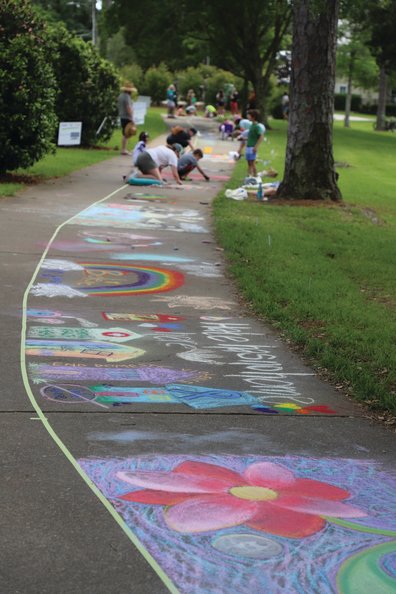Much of the sidewalk along the bluffs in Fairhope was decorated with colorful chalk creations on Saturday during the Chalk the Trail event.