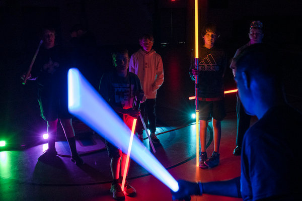 Students in Scott Prince’s Jedi academy go over choreographed swordplay in the gym at Gulf Shores Middle School.