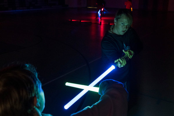 Two students in Scott Prince’s Jedi academy go over choreographed swordplay in the gym at Gulf Shores Middle School.