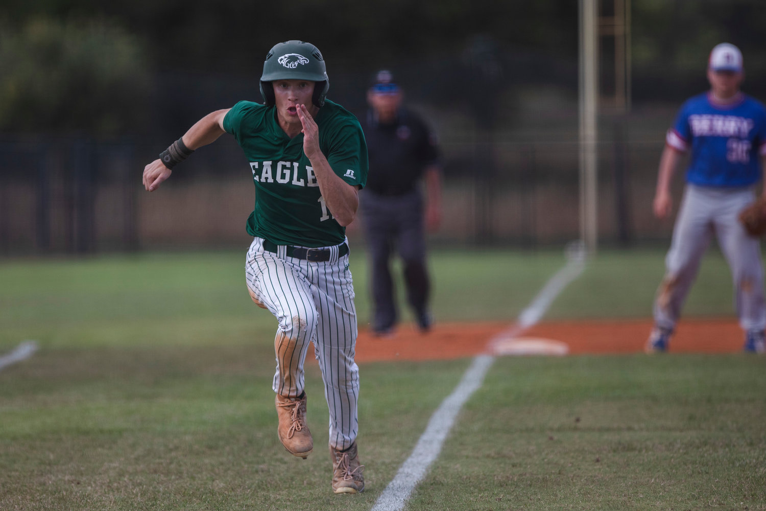 Eagle senior Cooper Schultze scampers home to score a run in Bayshore Christian’s Class 1A state quarterfinal series against the Berry Wildcats at Coastal Church in Daphne Thursday, May 5.